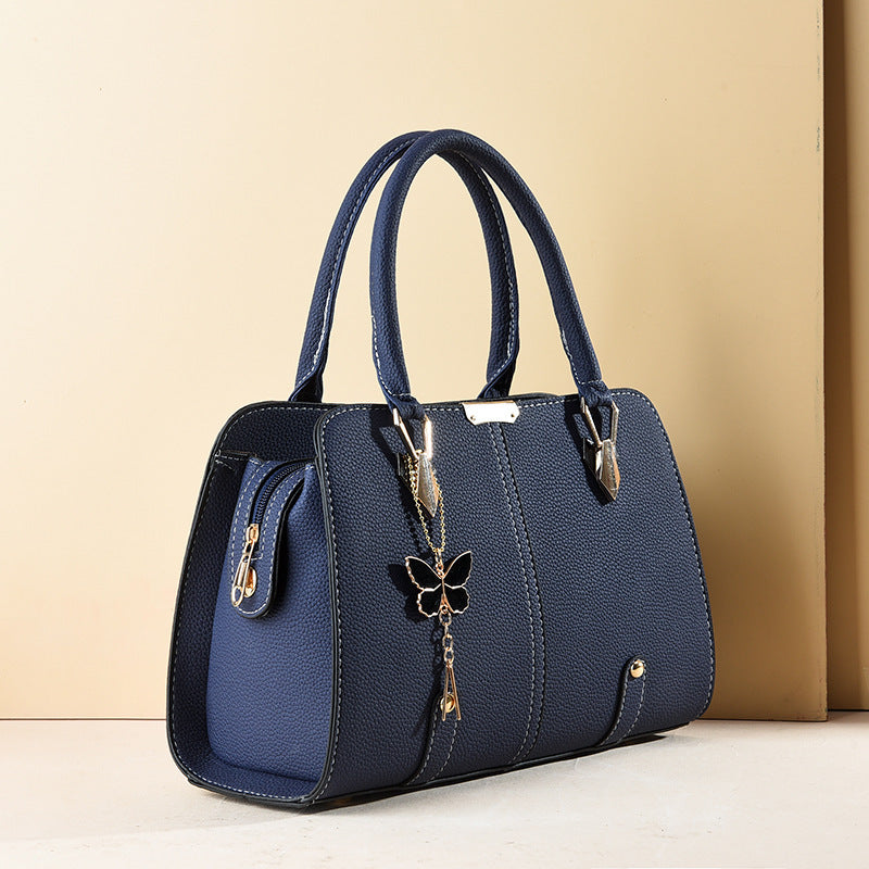 Sac à main avec breloque papillon – Élégant & structuré
