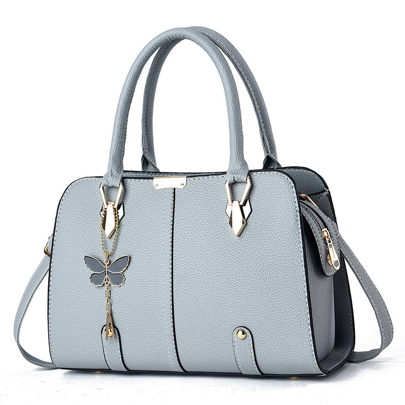 Sac à main avec breloque papillon – Élégant & structuré