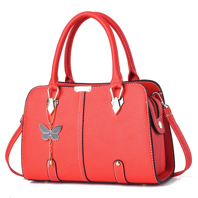 Sac à main avec breloque papillon – Élégant & structuré