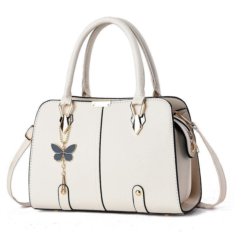 Sac à main avec breloque papillon – Élégant & structuré
